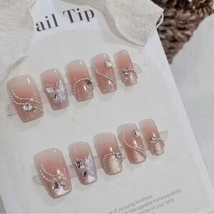 Elegant Pink and Gold Nail Tips with Crystal and Bead Accents